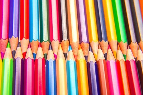 Sharpened multicolored pencils in a grid pattern. Suitable for art supplies.. Stock Photos