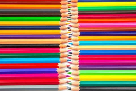 Sharpened multicolored pencils in a grid pattern. Suitable for art supplies.. Stock Photos