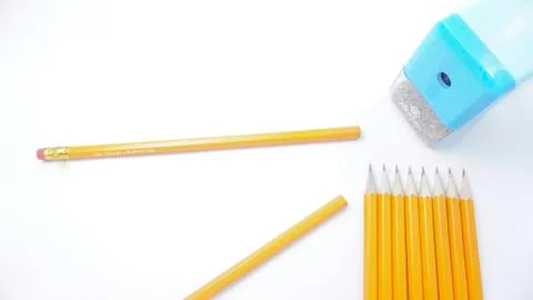 Sharpened pencils and sharpener are on a white background photo Stock Photos