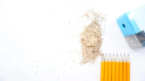 Sharpened pencils and sharpener are on a white background photo Stock Photos