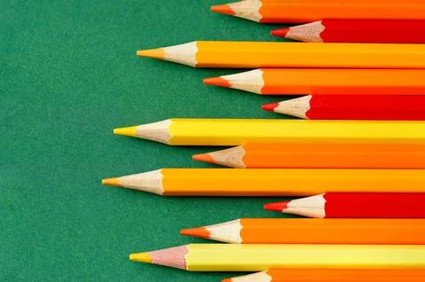 Sharpened pencils on a green background Stock Photos