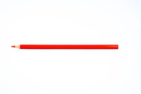 A sharpened red colored pencil crayon is isolated on a white background Stock Photos