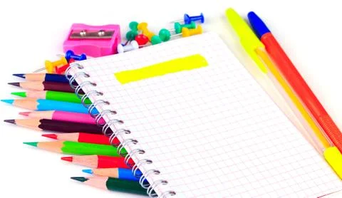 Sharpener and buttons next to the clear notepad Stock-Fotos