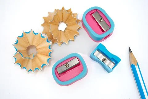 Sharpener set with blue pencil and wooden shavings, education tools Stock Photos