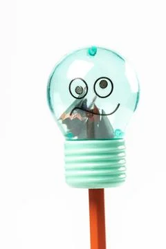 Sharpener in the shape of a light bulb and pencil, close-up Stock Photos
