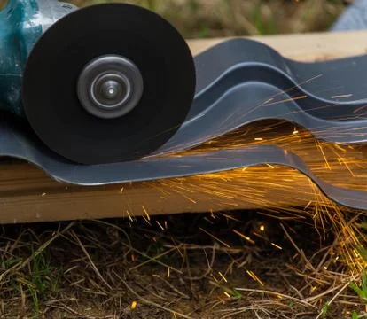 Sharpening and cutting by abrasive disk machine Stock Photos