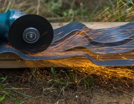 Sharpening and cutting by abrasive disk machine Stock Photos