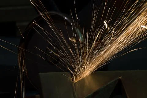 Sharpening and cutting by abrasive disk machine Stock Photos