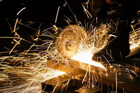 Sharpening and cutting of iron by abrasive disk machine Stock-Fotos