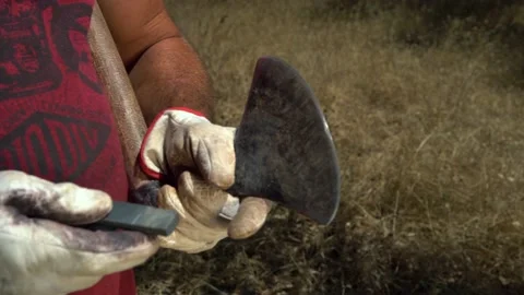 Sharpening an axe in Portugal Stock-Footage 164162556