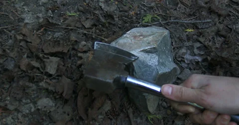 Sharpening axe on stone Stock Footage 39298421