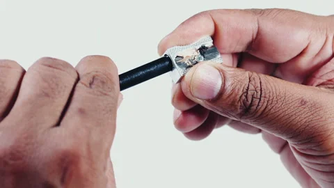 Sharpening Black Pencil with hands Stock Footage 248684525