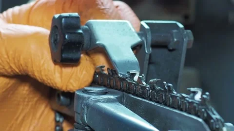 Sharpening chainsaw with abrasive disc from left side. Closeup shot Stock Footage 171209010
