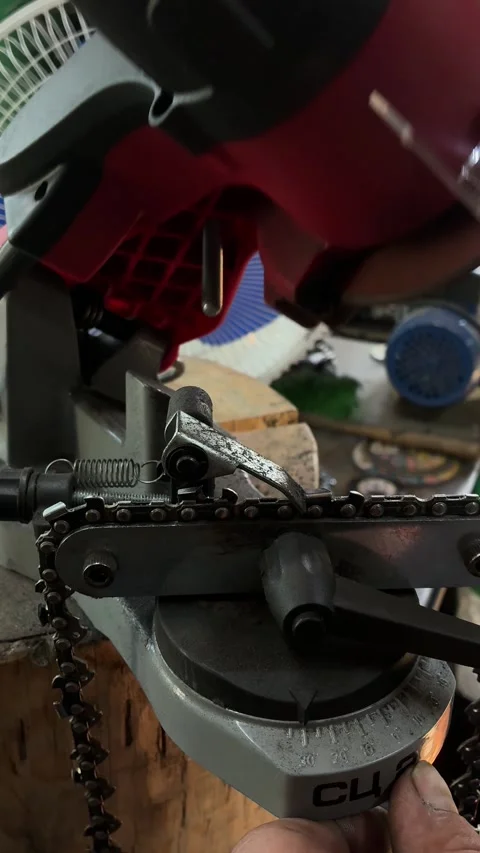 Sharpening Chainsaw Chain on Machine Stock Footage 341574393
