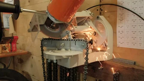 Sharpening a chainsaw chain on a special machine Stock Footage 166533990