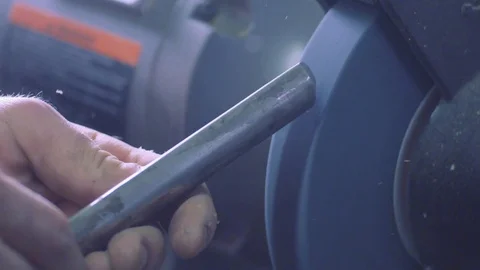 Sharpening a chisel Stock Footage 83496283