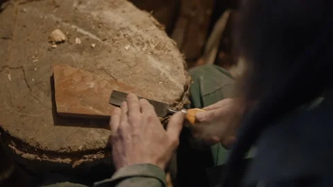 Sharpening a chisel with a whetstone Video stock 169156262