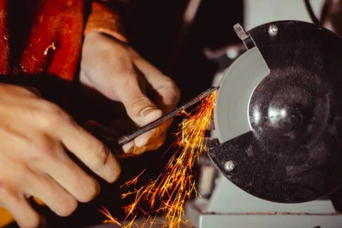 Sharpening the cutter on the machine Stock Photos