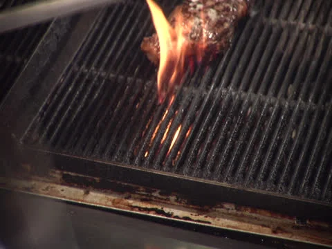 Sharpening cutting knife over grill, rackfocus series, static Stock Footage 26191141