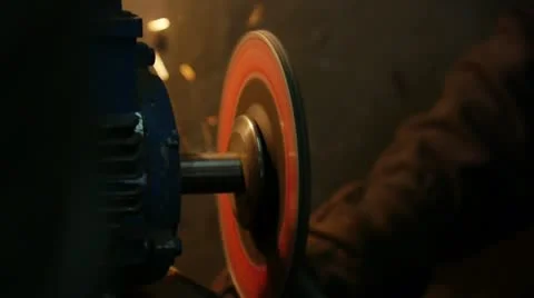 Sharpening the details using a grinder , sparks fly Stockbeeldmateriaal 11339573