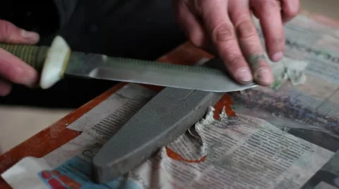 Sharpening a diving knife 스톡 동영상 59775392