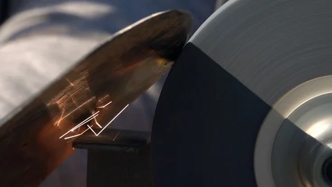 Sharpening of garden tool with unbalanced grinding machine slow motion close up Stock Footage 98676444