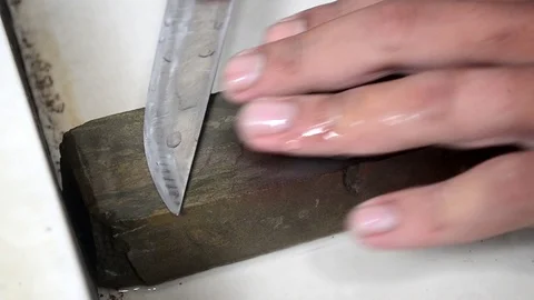 Sharpening kitchen knife Stock Footage 91876676