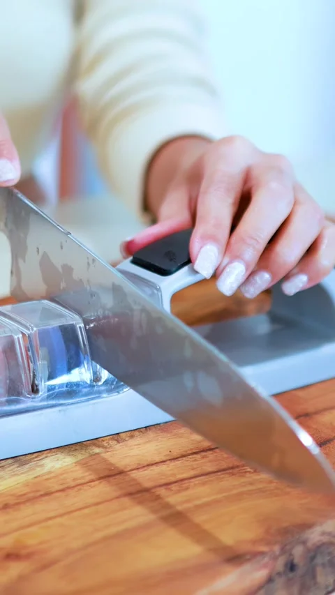 Sharpening Kitchen Knife with Manual Whetstone Tool 動画素材 313970242