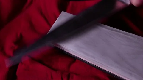 Sharpening kitchen knife on a whetstone. 4K UHD Stock Footage 73020854