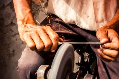 Sharpening a knife blade Stock Photos