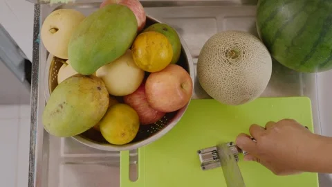 Sharpening knife before cutting fruit Stock Footage 280463229