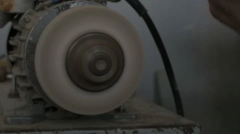 Sharpening a knife with an electric tool Stock Footage 47982684