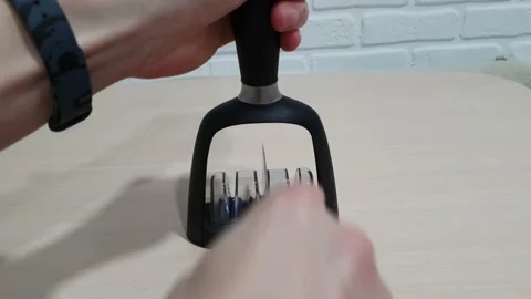 Sharpening the knife Stock Footage 149439541