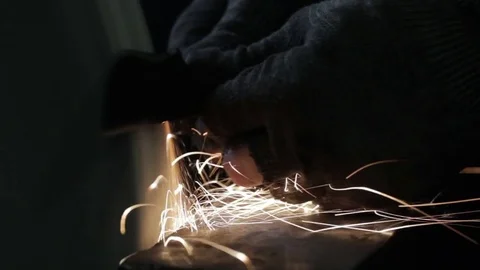 Sharpening the knife on the grinding machine. Close-up. Stock Footage 80756434