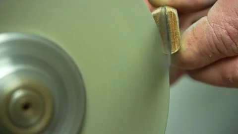 Sharpening of knife via small home grinding machine. Closeup shot Stock Footage 237114629