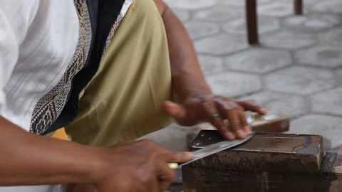Sharpening the knife with whetstone Stock Footage 141831442