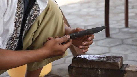 Sharpening the knife with whetstone Stock Footage 141831498