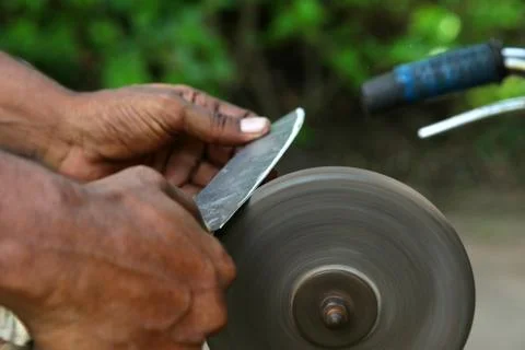 Sharpening the knife with whetstone 写真素材