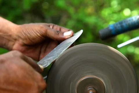Sharpening the knife with whetstone Stock Photos