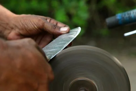 Sharpening the knife with whetstone Stock Photos