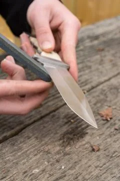 Sharpening large knife Stock Photos
