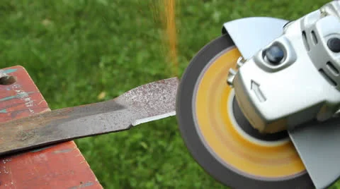 Sharpening a lawnmower blade Stock Footage 24845592