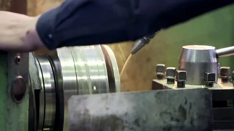 Sharpening machine grinds iron with coolant Video stock 76856879