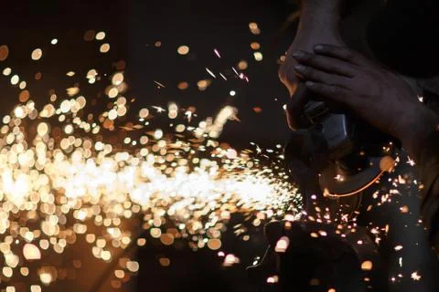 Sharpening metal, making of an axe Stock Photos