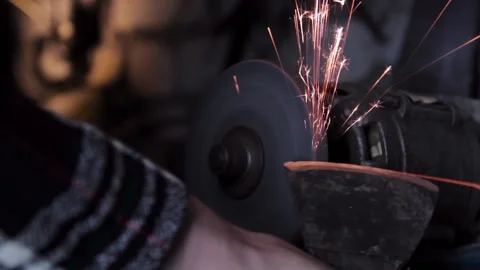 Sharpening an old grain ax close-up with bright sparks Stock Footage 136442178