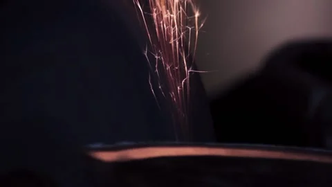 Sharpening an old grain ax close-up with bright sparks Stock Footage 137970696