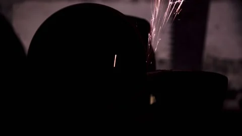 Sharpening an old grain ax close-up with bright sparks. copy space 動画素材 137970706