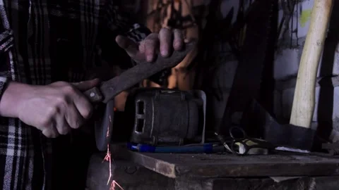 Sharpening an old knife close-up with bright sparks Video stock 135655072