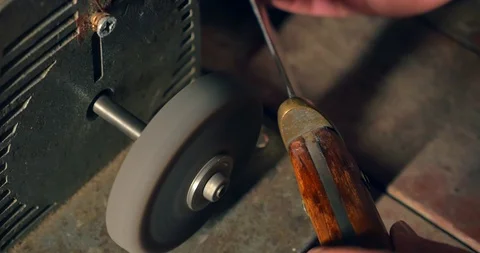 Sharpening the old knife on the grinding machine. Close-up 库存影片 98213333