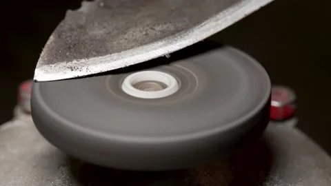 Sharpening an old metal knife Stock Footage 169835395
